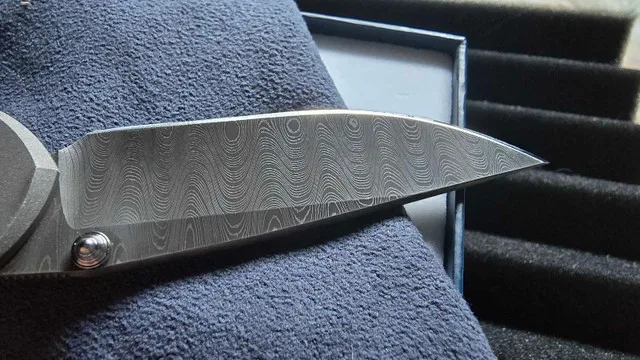 Chris reeve sebenza 21 ladder damascus discontinued image indicator(4)