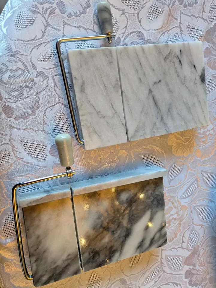 Two marble cheese slicers and serving boards thumbnail