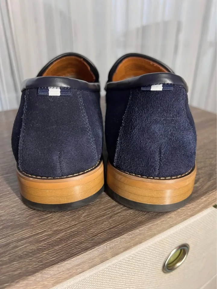Pair of navy suede loafers. image indicator(6)