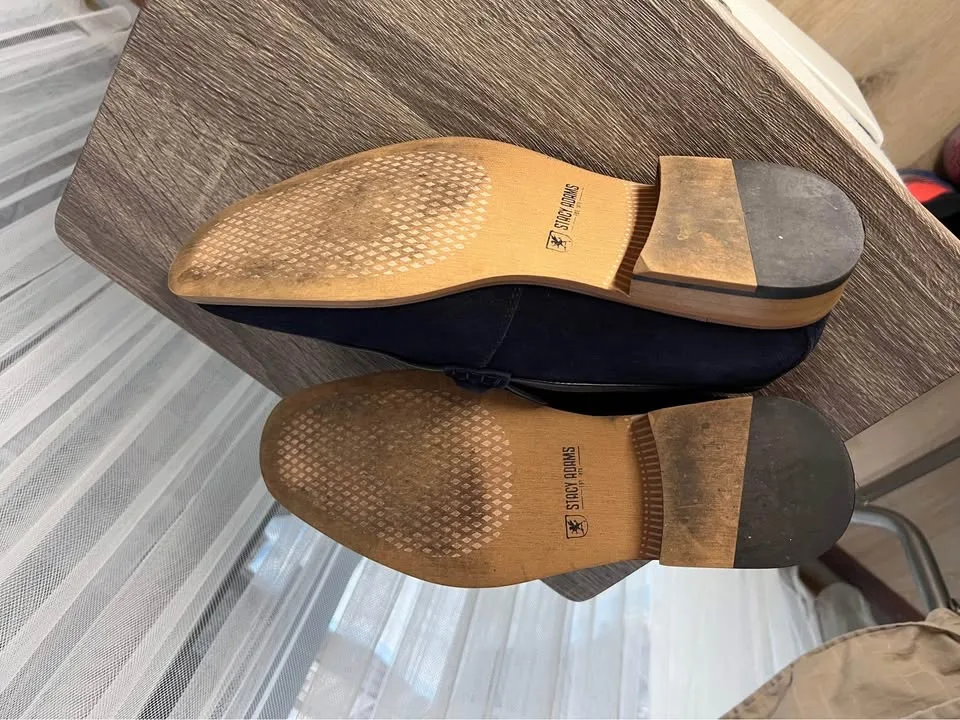 Pair of navy suede loafers. image indicator(7)