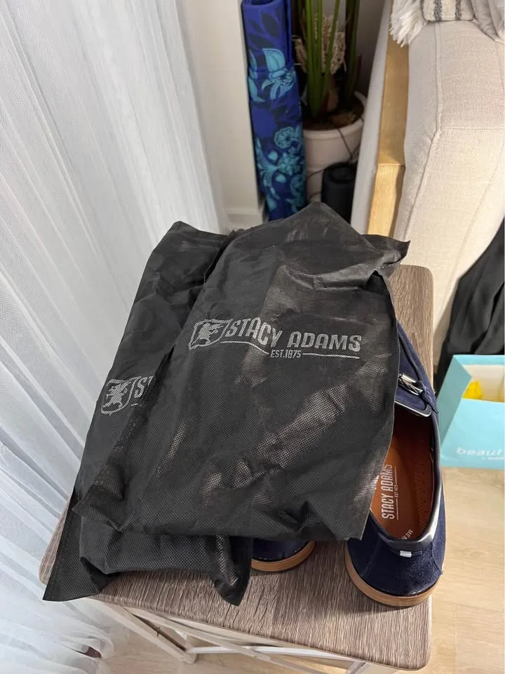 Pair of navy suede loafers. image indicator(8)