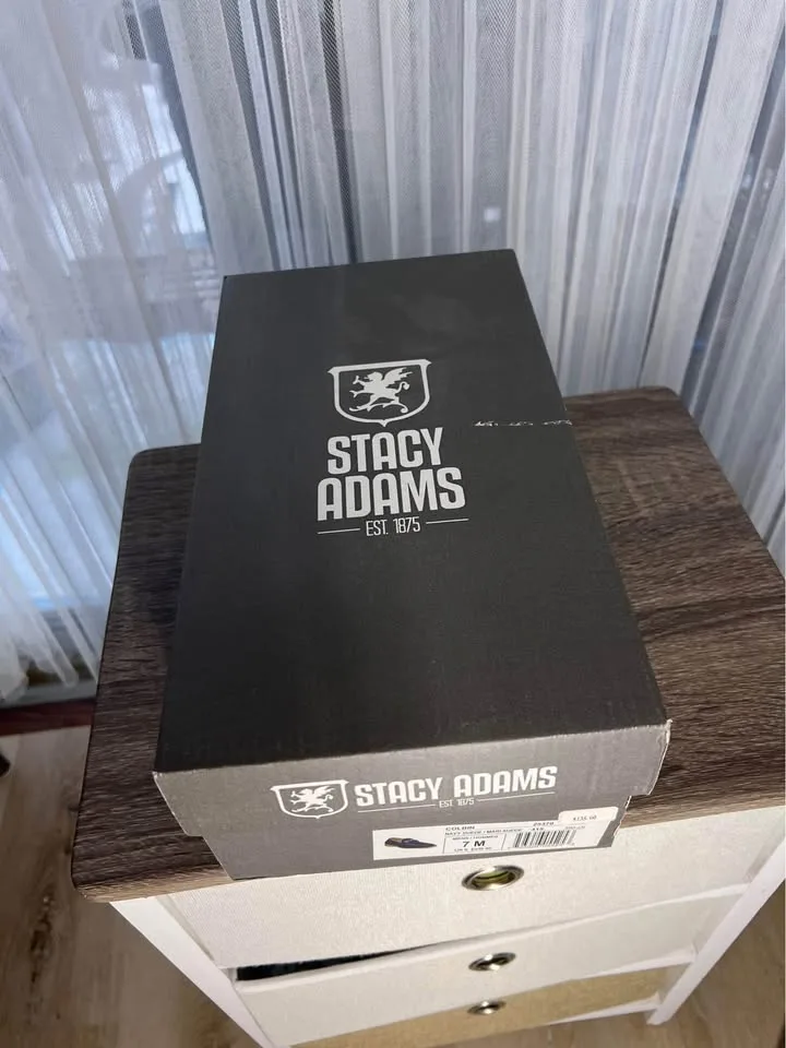 Pair of navy suede loafers. image indicator(9)