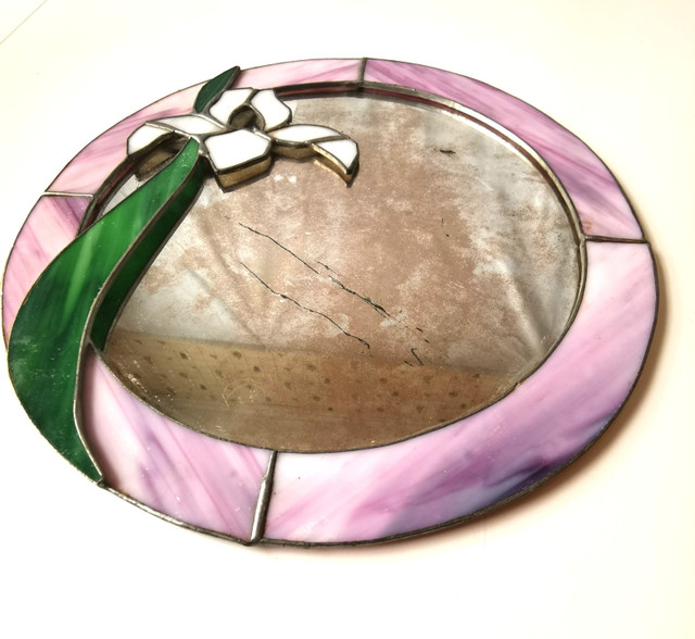 Stained glass mirror featuring an iris flower design older vinta