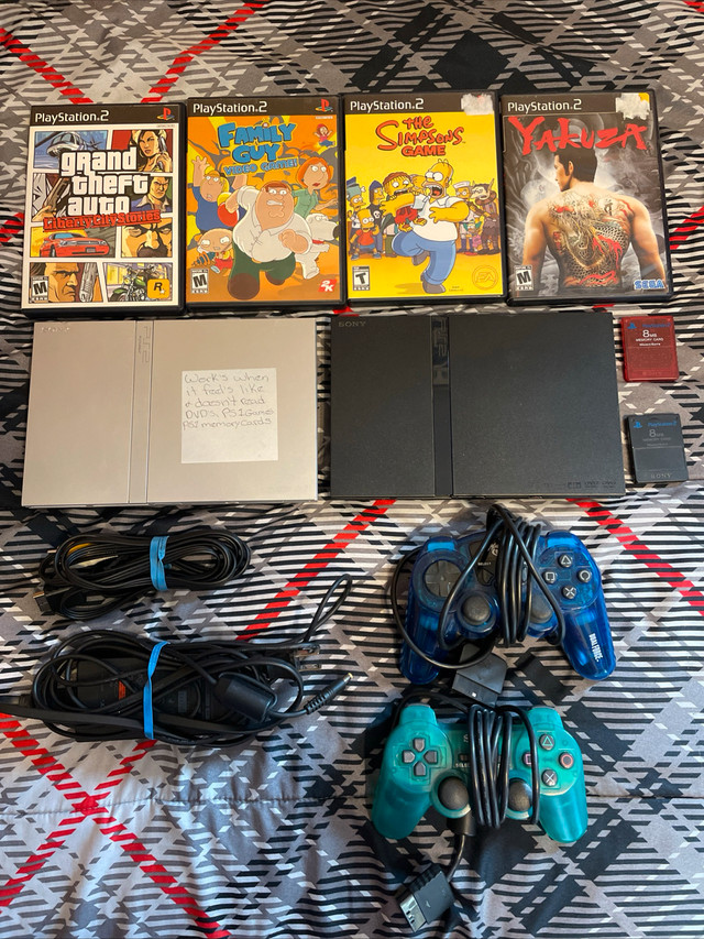 2 PlayStation 2 Consoles W/ 2 Controllers, 2 Memory Cards,4games
