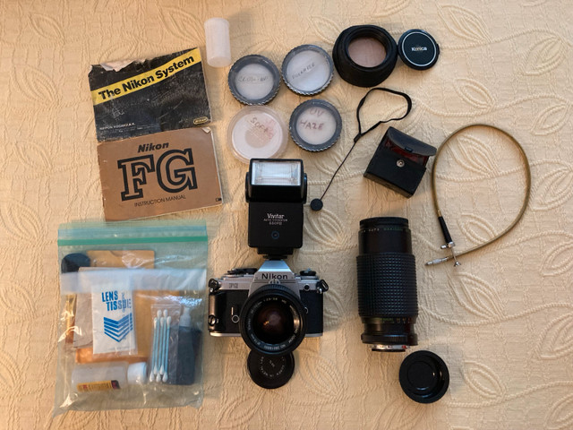 Vintage Nikon FG camera with macro lense and tripod