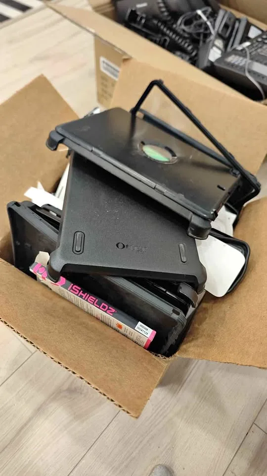 3 Boxes of cases for iPads and iPhones