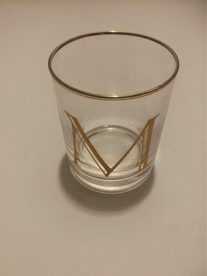 Gold Trimmed Glass with 'M' Design