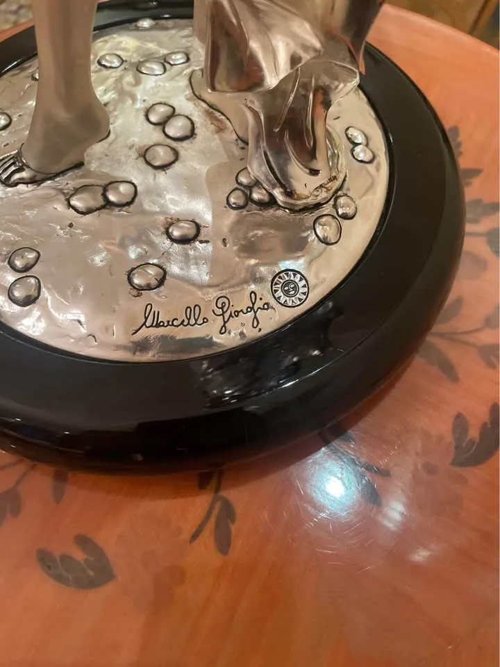 Silver statue of lady with grapes image indicator(6)