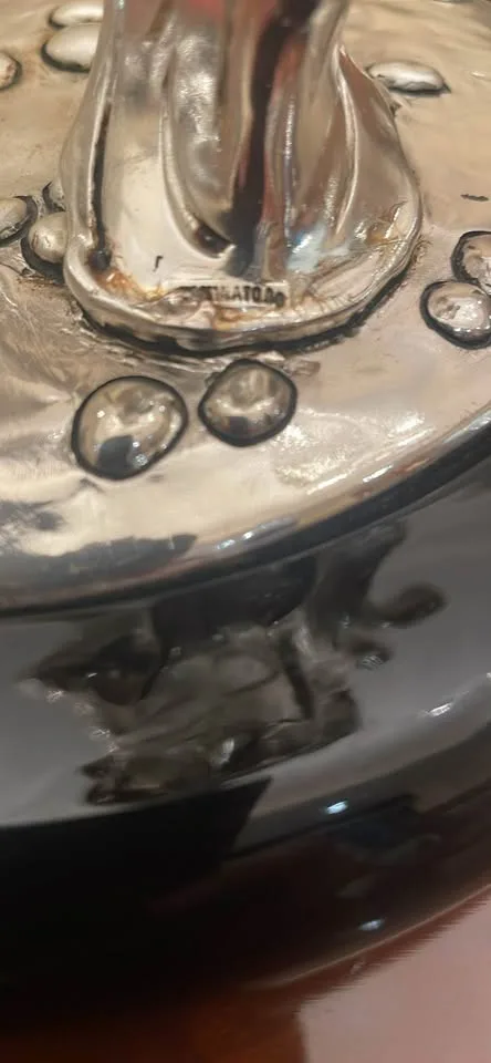 Silver statue of lady with grapes image indicator(8)