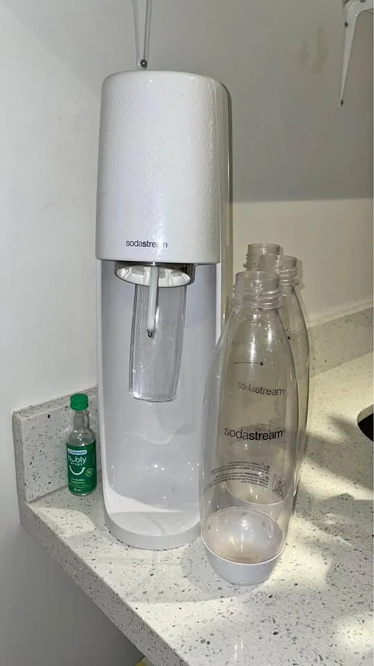 White Sodastream with Bottles, Gas Canister and Lime Bubly syrup