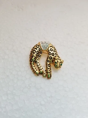 Vintage Leopard Rhinestone brooch with green eyes. Overall good