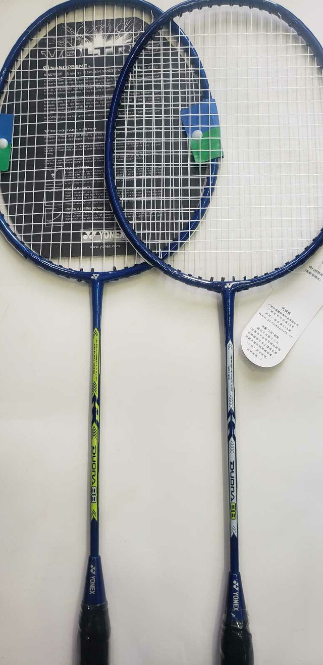 A Pair of Yonex Duora 88 Badminton Racket