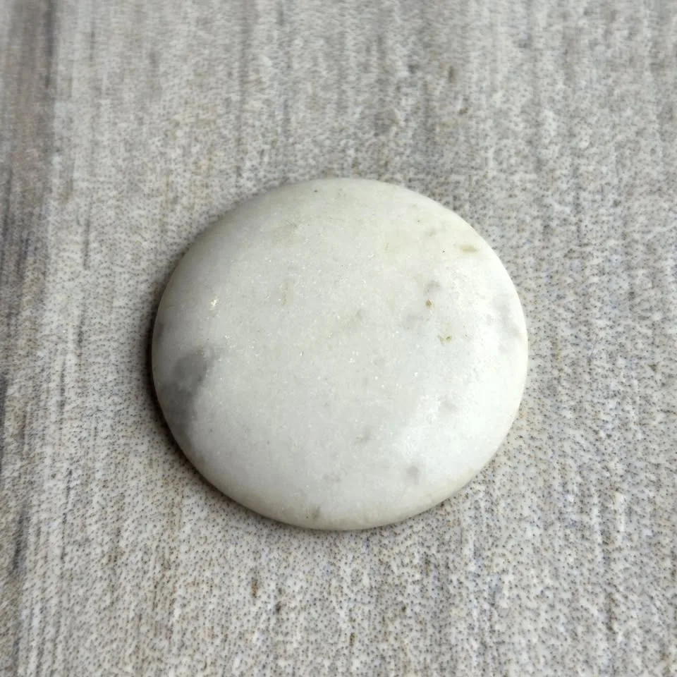 White agate cabochon stone.