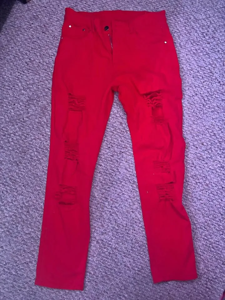 ripped red jeans