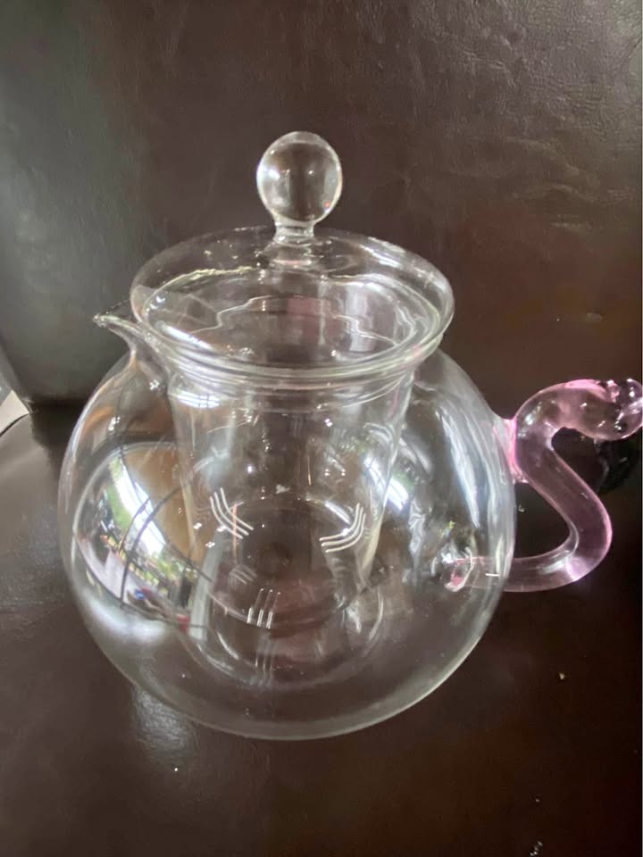Clear glass teapot with flamingo handle
