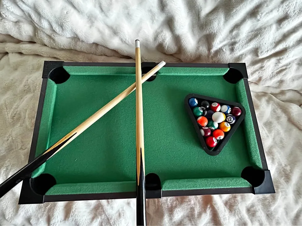 Slightly Used Mini Pool Table with Cue Balls and Sticks