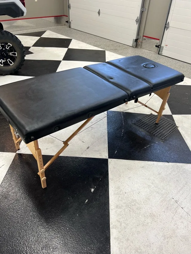Folding massage table
