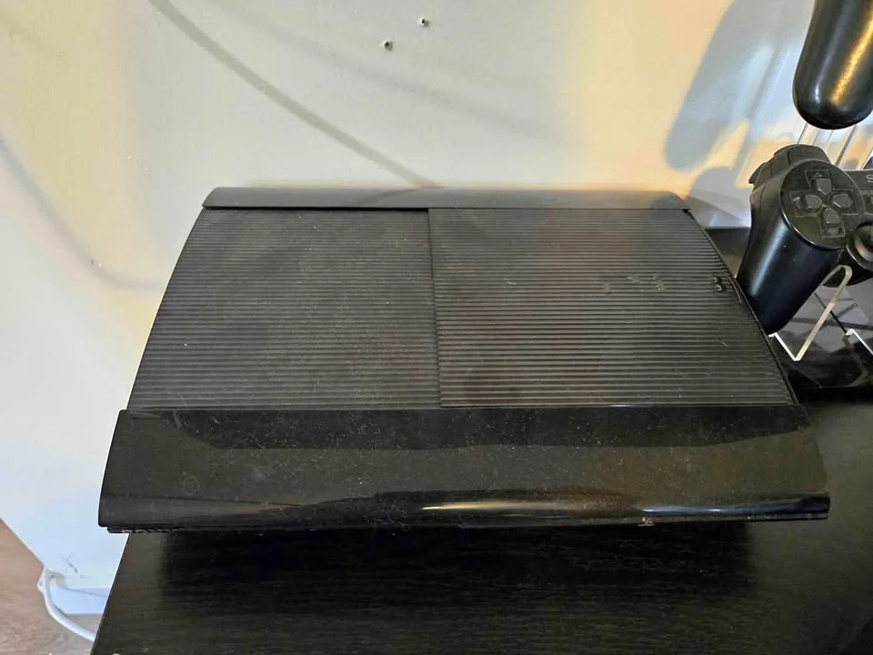 PlayStation 3 Super Slim Console w/ two controllers