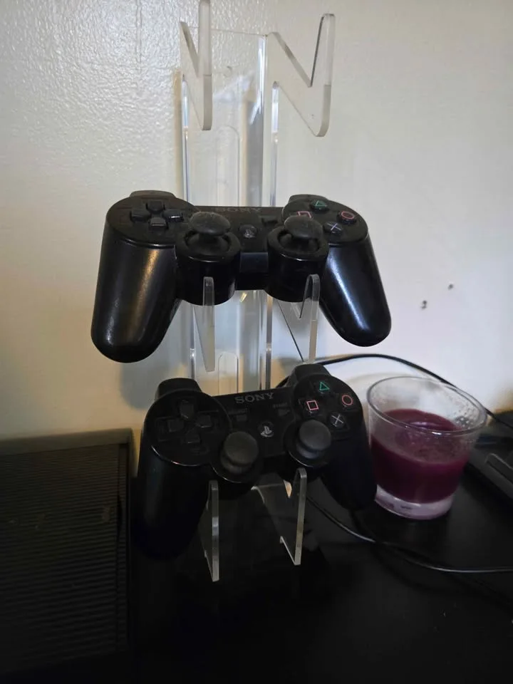 PlayStation 3 Super Slim Console w/ two controllers image indicator(2)