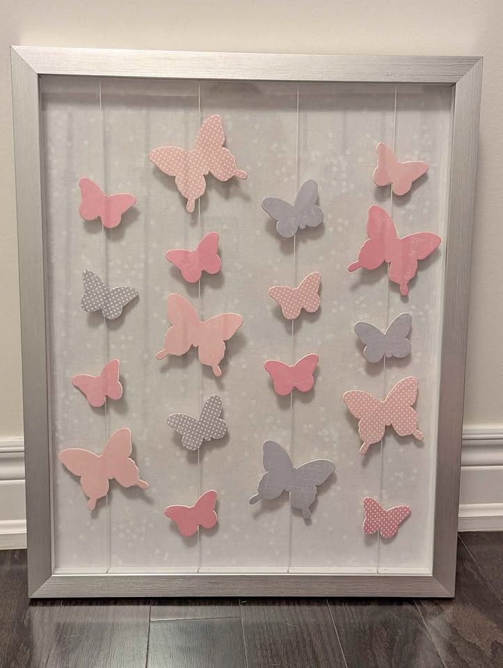 Butterfly wall art in a silver frame