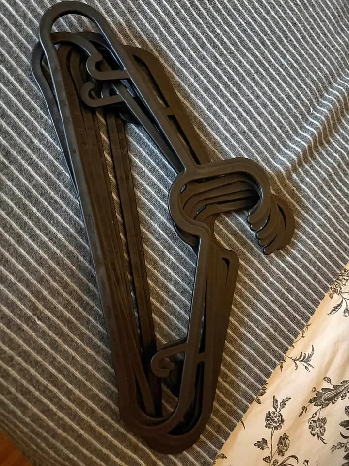 8 Black Plastic Hangers thumbnail