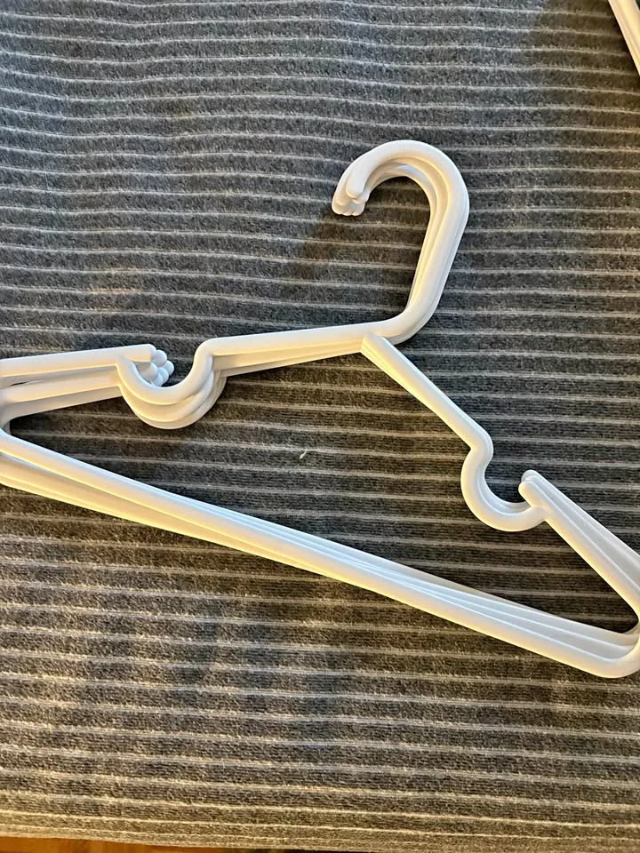 6 Small White Plastic Hangers thumbnail