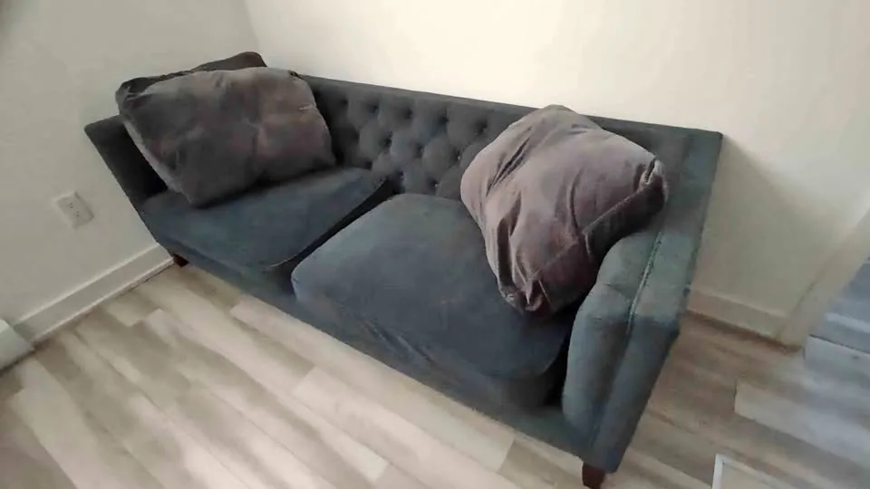 Green Two-Seater Velvet Sofa with Throw Pillows