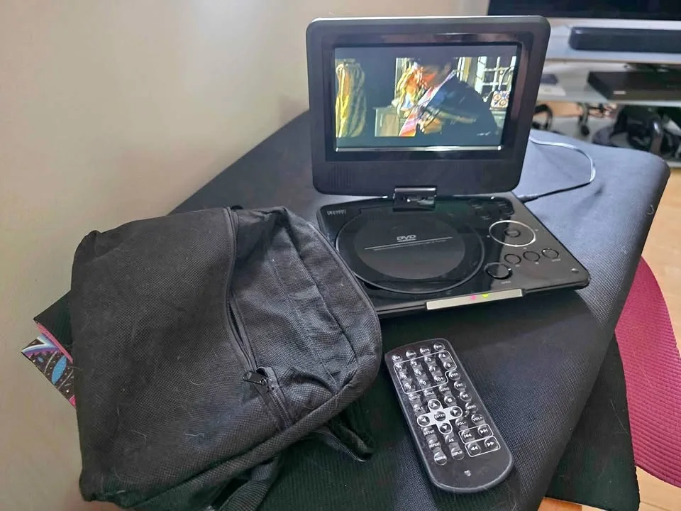 Portable dvd player with remote and carry bag, all cords   like thumbnail