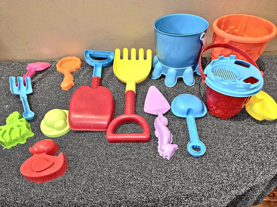 Set of colorful plastic beach sand toys. 15 pcs
