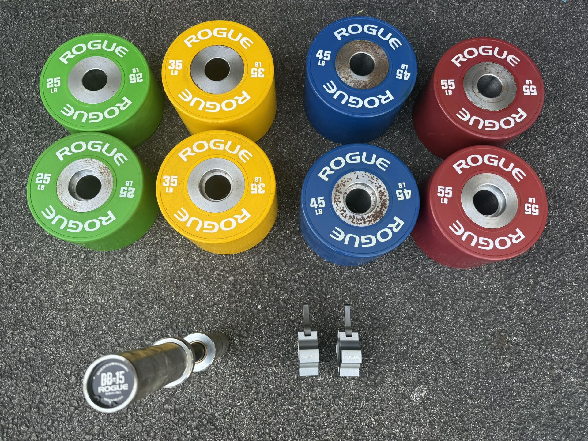 Rogue Fitness dumbbell bumpers, handles, collars