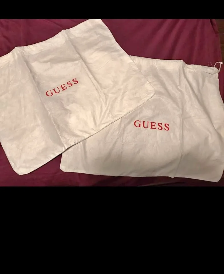 Set of 2 Guess dust-covers. $3 each or both for $5. Pu at Kiplin