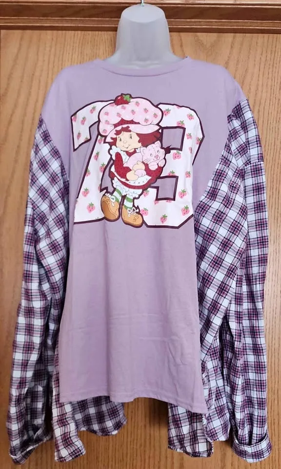 Upcycled Strawberry Shortcake Shirt. Will fit up to a size X-Lar