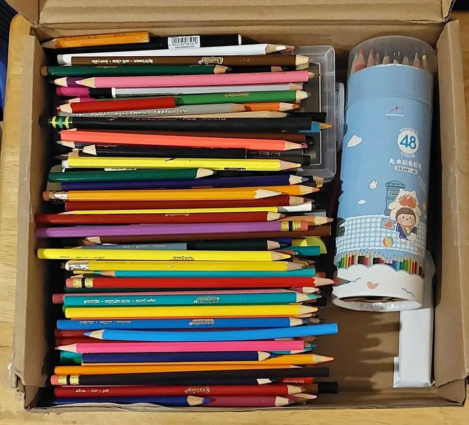 Art supplies, pencil crayons, paper