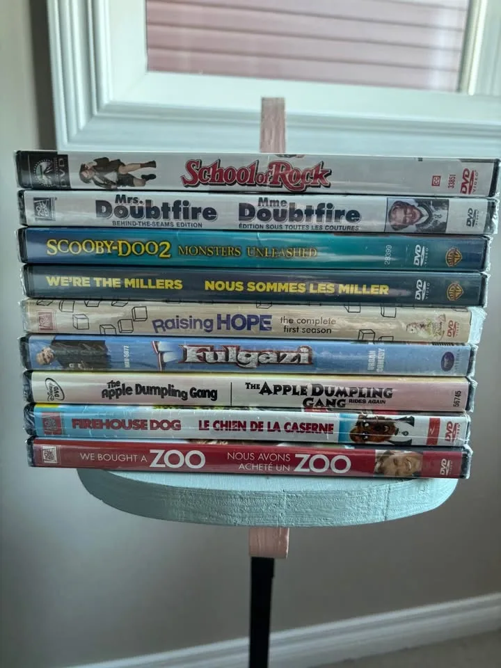 All For $15 9 Family Fun DVDS, 7 Never Opened image indicator(2)