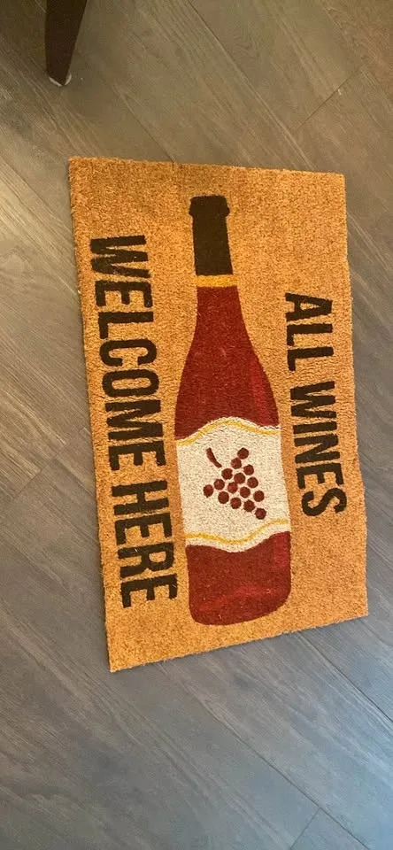 Door mat - wine theme. Dimensions are 18in by 30in.