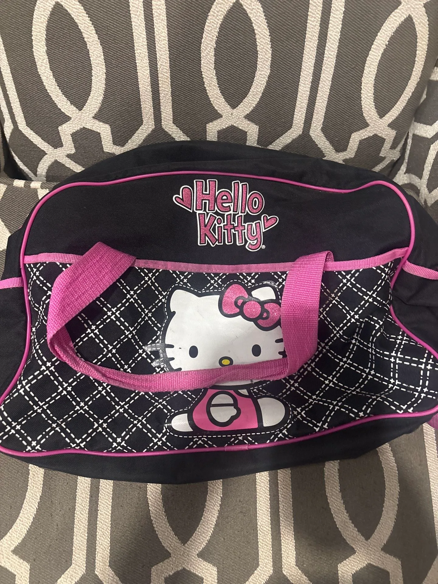 Super cute Hello Kitty duffel bag in black with pink trim and qu image indicator(2)