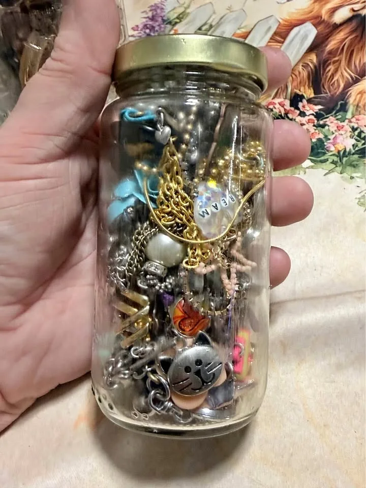 Small jar of cute costume jewellery