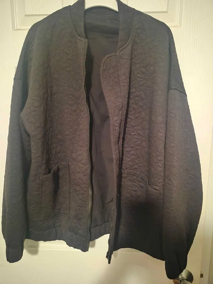 Black quilted bomber style jacket image indicator(2)