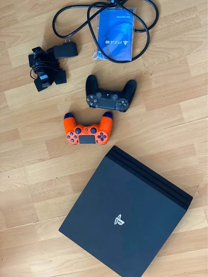 PlayStation 4 Pro 1TB Console, 3 controllers and 3 games image indicator(2)