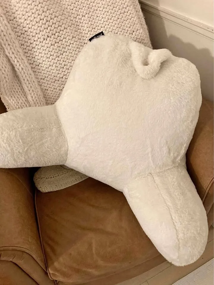White fur reading pillow with arms