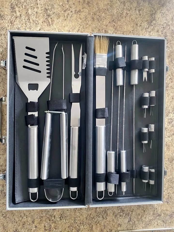 stainless steel BBQ tool set in a carrying case.