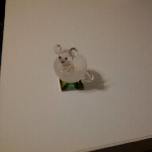 Crystal mouse in teacup