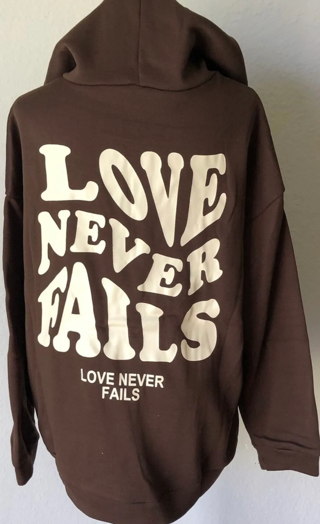 Shein “Love Never Fails” Graphic Drawstring Hoodie XS image indicator(6)