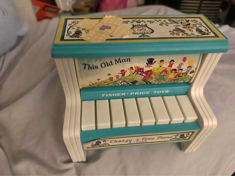 Fisher-Price Change-a-Tune Piano toy.