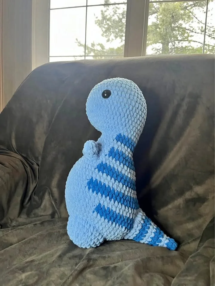 Handmade crochet blue dinosaur toy