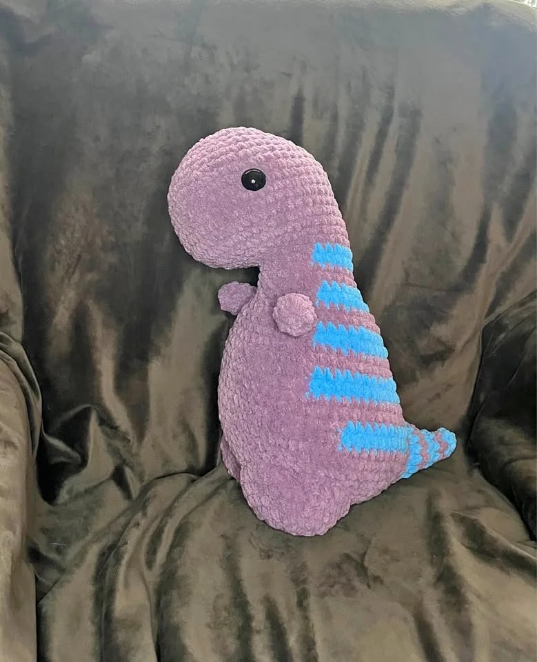 Handmade crochet purple dinosaur toy