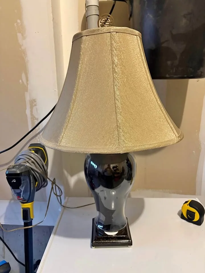 Black table lamp with beige shade