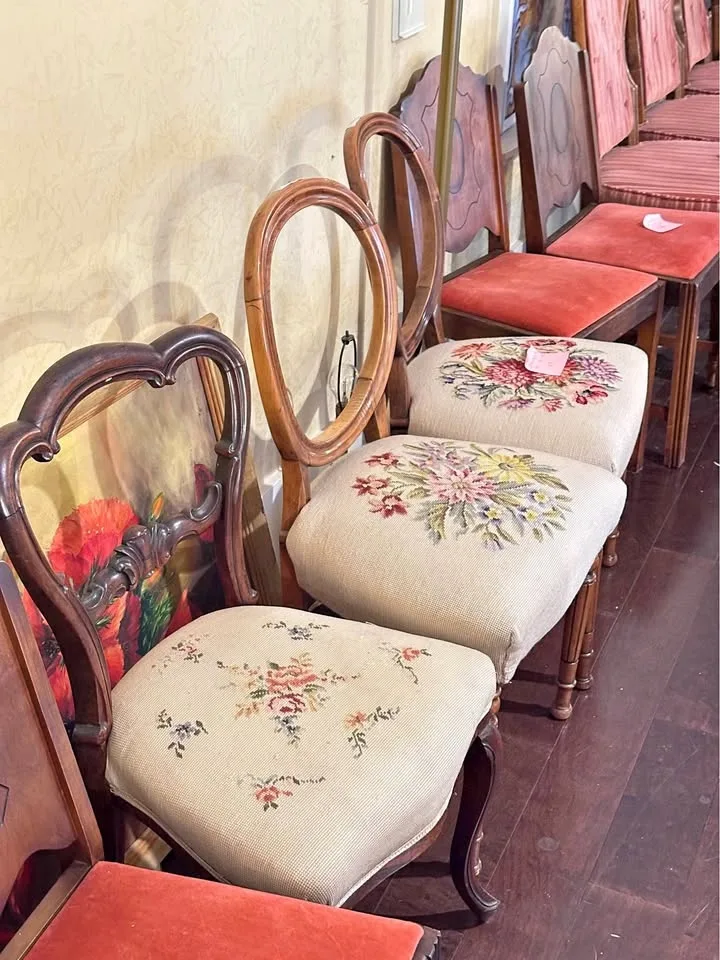 Vintage chairs with detailed wood frames