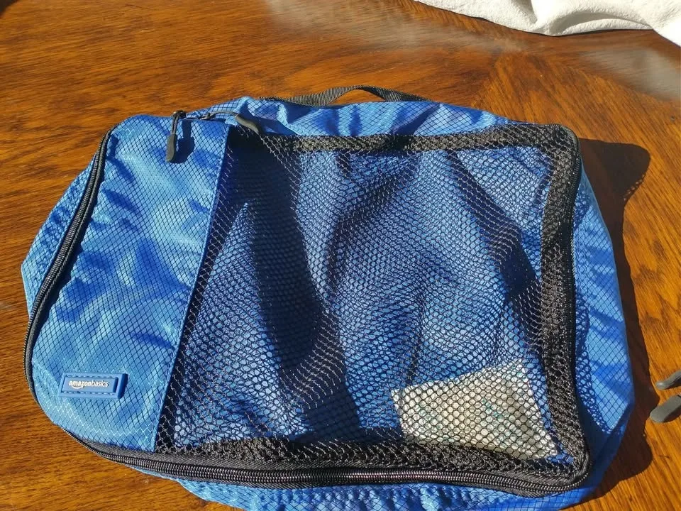 Amazon Basics 4-piece Travel Cubes; Never Used image indicator(4)