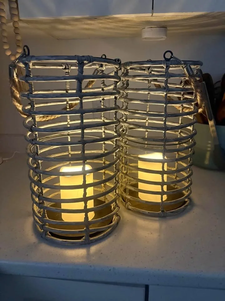 Pair of plastic wicker lanterns.